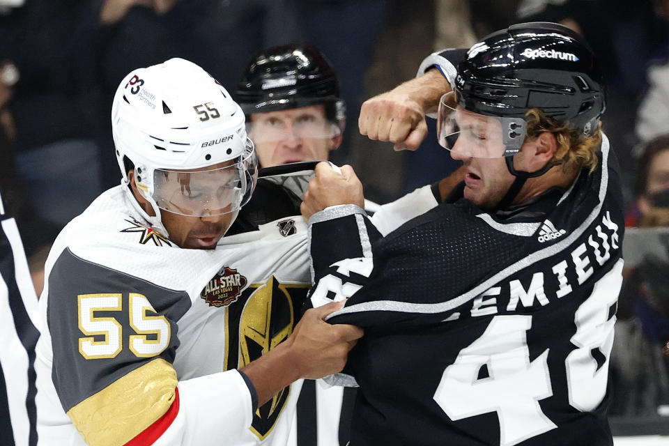 Vegas Golden Knights forward Keegan Kolesar (55) and Los Angeles Kings forward Brendan Lemieux (48) fight during the first period of an NHL hockey game Thursday, Oct. 14, 2021, in Los Angeles. (AP Photo/Ringo H.W. Chiu)