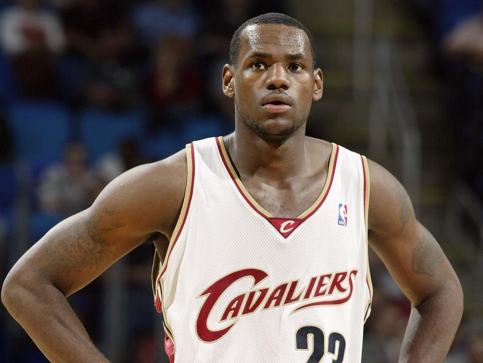 LeBron James stands with his hands on his hips and looks on during a 2003 game.