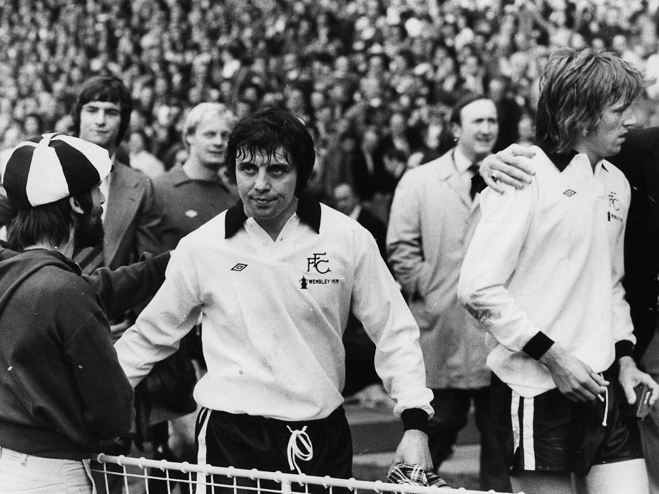Jimmy Conway (left) and John Mitchell, two dejected Fulham players leave the pitch at Wembley after being beaten 2-0 in the FA Cup Final against West Ham United: Frank Tewkesbury/Evening Standard/Getty Images