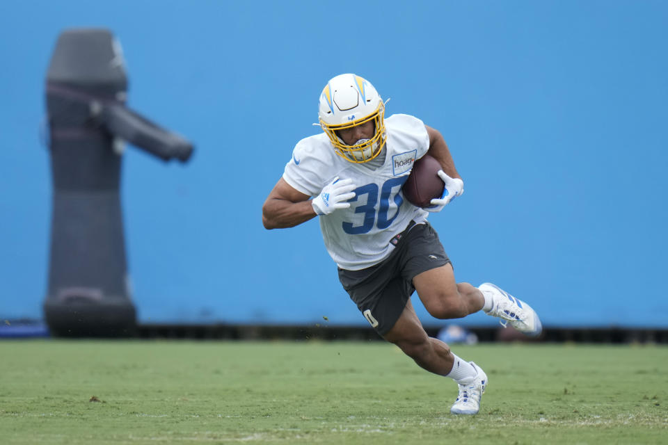 Now that Austin Ekeler's contract situation is resolved, we'll find out what new offensive coordinator Kellen Moore has in store for the Chargers.  reverse star.  (AP Photo/Jae C. Hong)