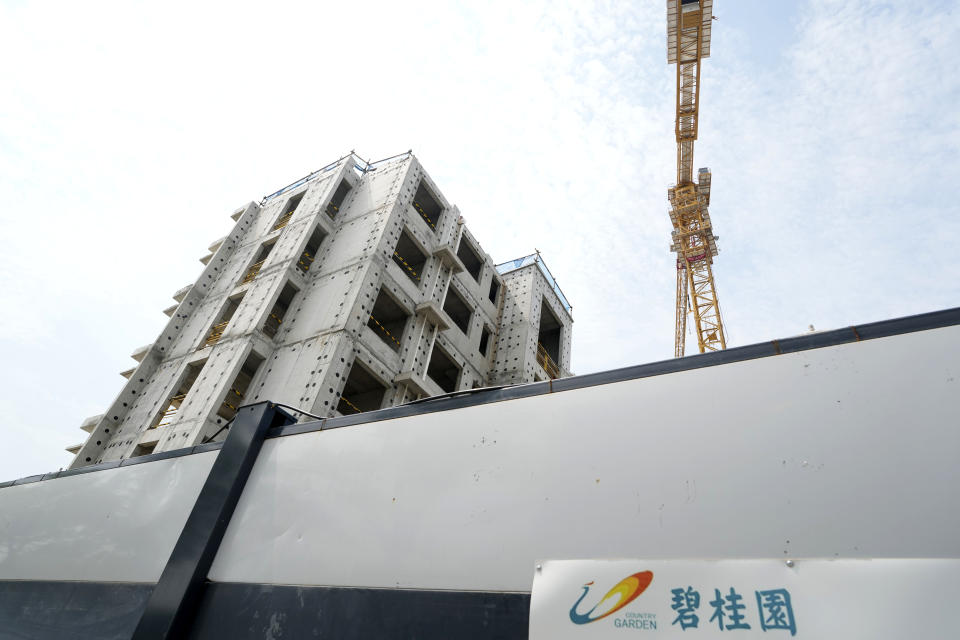 The logo for Country Garden developer is seen near the Country Garden One World City project under construction on the outskirts of Beijing, Thursday, Aug. 17, 2023. China's government is trying to reassure jittery homebuyers after the major real estate developer missed a payment on its multibillion-dollar debt, reviving fears about the industry's shaky finances and their impact on the struggling Chinese economy. (AP Photo/Ng Han Guan)