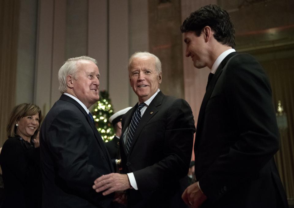 FILE - Former Canadian Prime Minister Brian Mulroney, left, greets U.S. Vice President Joe Biden and Prime Minister Justin Trudeau as they arrive at a state dinner, Thursday, Dec. 8, 2016, in Ottawa, Ontario. Mulroney has died at the age of 84, his daughter Caroline Mulroney posted on social media, Thursday, Feb. 29, 2024. (Justin Tang/The Canadian Press via AP, File)