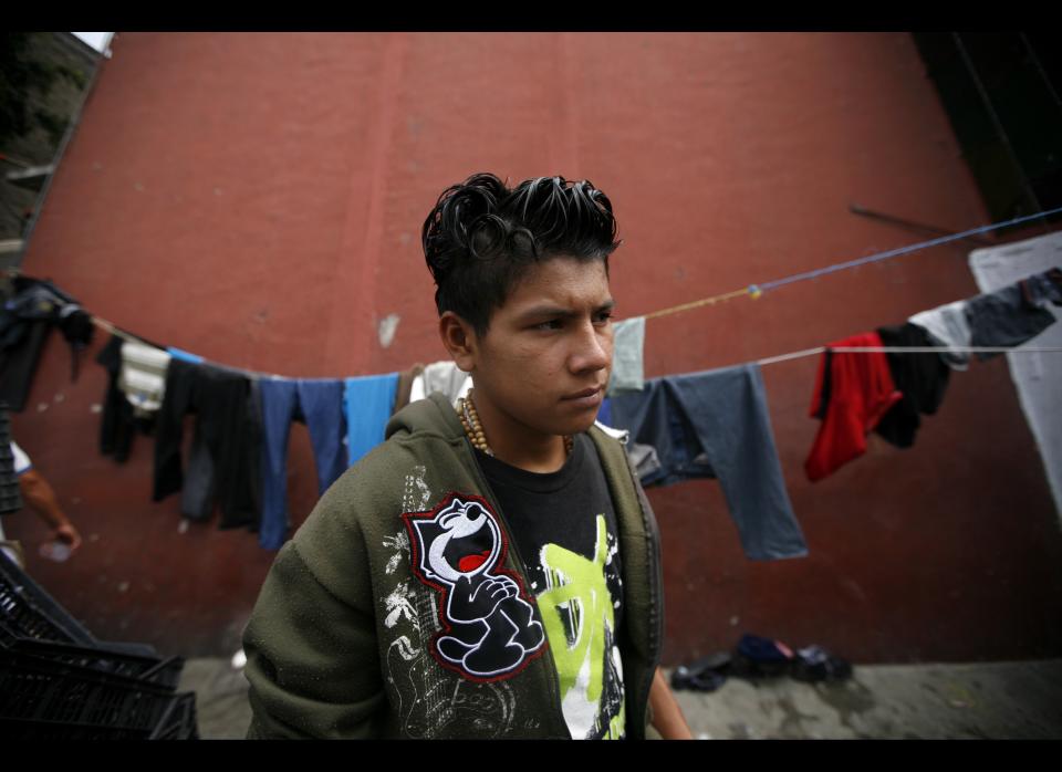 In this May 12, 2012 photo, Manuel de Jesus Chavez, 16, a migrant from El Salvador, waits for a north bound train to continue his journey to the US-Mexico border, at a shelter in Lecheria, on the outskirts of Mexico City. While the number of Mexicans heading to the U.S. has dropped dramatically, a surge of Central American migrants is making the 1,000-mile northbound journey this year, fueled in large part by the rising violence brought by the spread of Mexican drug cartels. (AP Photo/Marco Ugarte)  