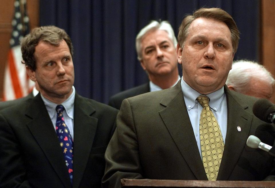 Brown looks on as Teamsters Union President James P. Hoffa voices his opposition to Mexican trucks entering the U.S. under the NAFTA deal, in Washington, D.C., in 2001. (Photo: Luke Frazza/AFP/Getty Images)