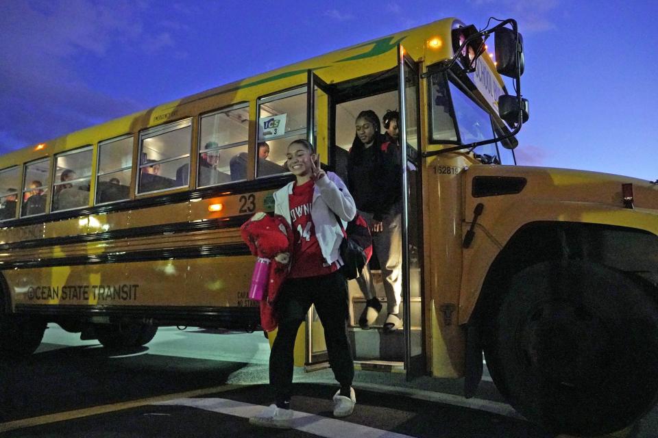Members of the East Providence girls basketball team get off the bus Wednesday after a 90-minute drive from the high school to La Salle Academy.