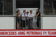 German national football team player Bastian Schweinsteiger (2nd L) is pictured during a visit to the Mercedes stand in the pits at the Circuit de Monaco on May 27, 2012 in Monte Carlo during the Monaco Formula One Grand Prix. AFP PHOTO / DIMITAR DILKOFFDIMITAR DILKOFF/AFP/GettyImages