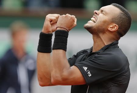 Jo-Wilfried Tsonga of France celebrates after beating Tomas Berdych of the Czech Republic during their men's singles match at the French Open tennis tournament at the Roland Garros stadium in Paris, France, May 31, 2015. REUTERS/Pascal Rossignol