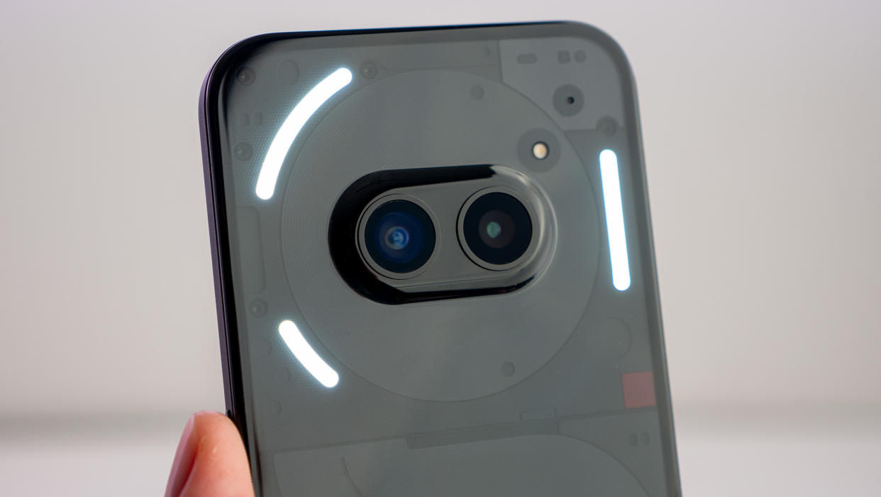  The camera island on the back of the Nothing Phone (2a) with the glyph lights illuminated. 