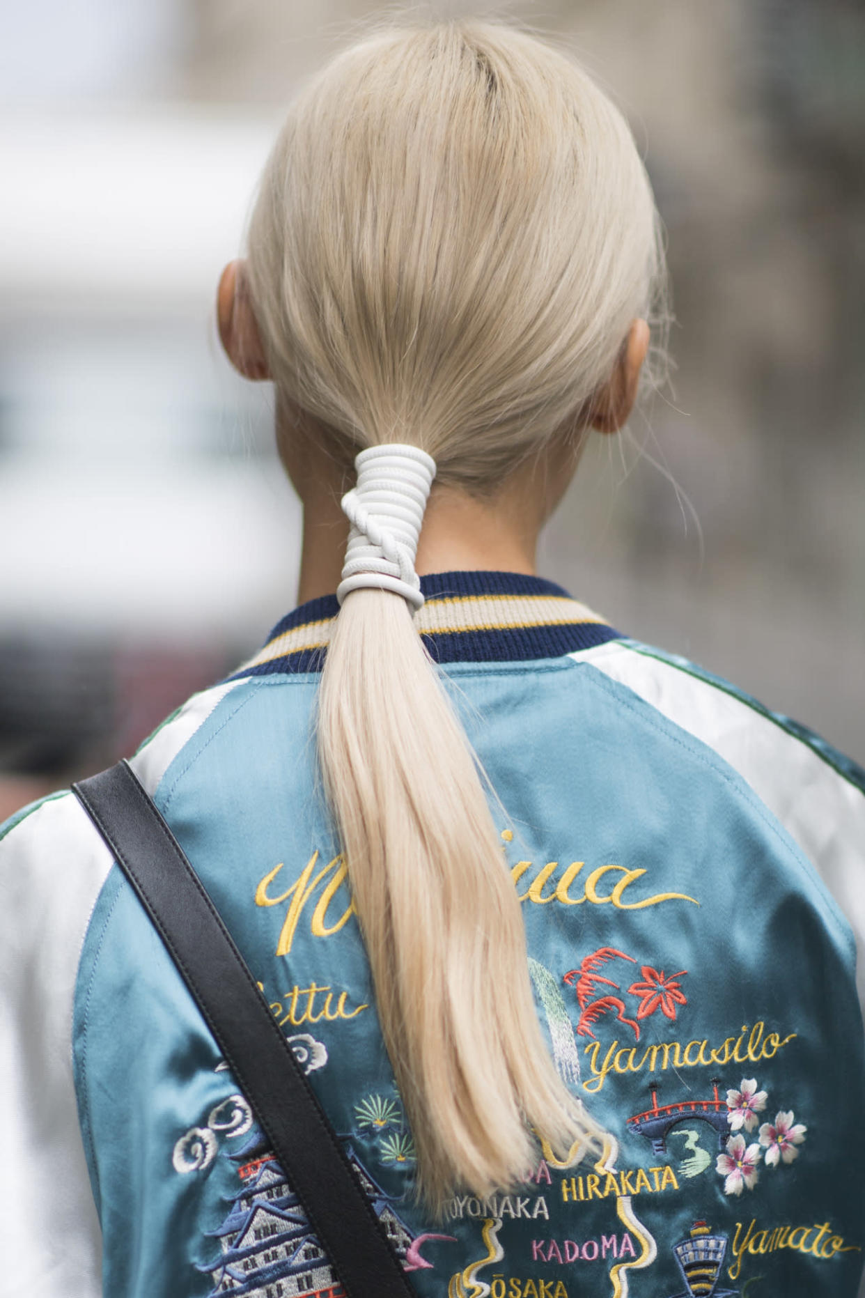  A model with a wrapped ponytail on the streets of Paris. (Photo: Getty Images)