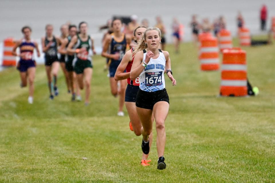 Lansing Catholic's Tessa Roe approaches the finish line during the Division 3 state cross country final on Saturday, Nov. 5, 2022, at Michigan International Speedway in Brooklyn.