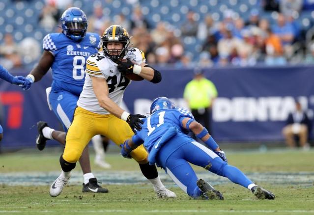 Iowa senior and Highland product Sam LaPorta heads upfield after hauling in a pass against Kentucky during the Music City Bowl on Dec. 31. LaPorta was selected in the second round of the NFL draft on Friday night.