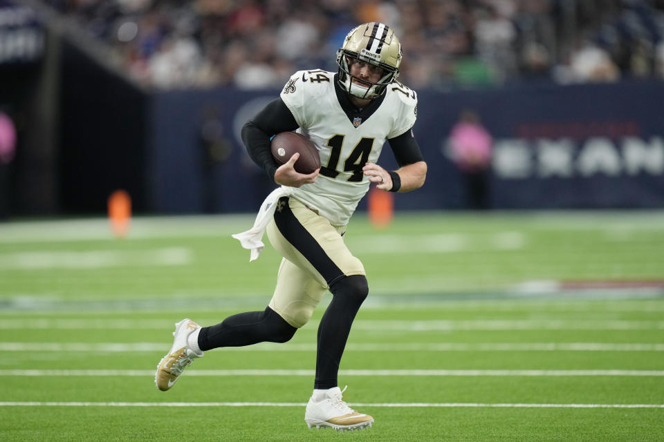 New Orleans Saints quarterback Andy Dalton (14) runs against the Houston Texans during the first half of an NFL preseason football game Saturday, Aug. 13, 2022, in Houston. (AP Photo/Eric Christian Smith)