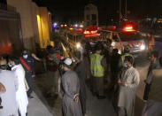 Amubalnces park close to the site of bomb blast in Quetta, Pakistan, Wednesday, April 21, 2021. A powerful bomb went off in the parking area of a five-star Serena hotel in the southwestern city of Quetta on Wednesday, wounding some people, police said. (AP Photo/Arshad Butt)