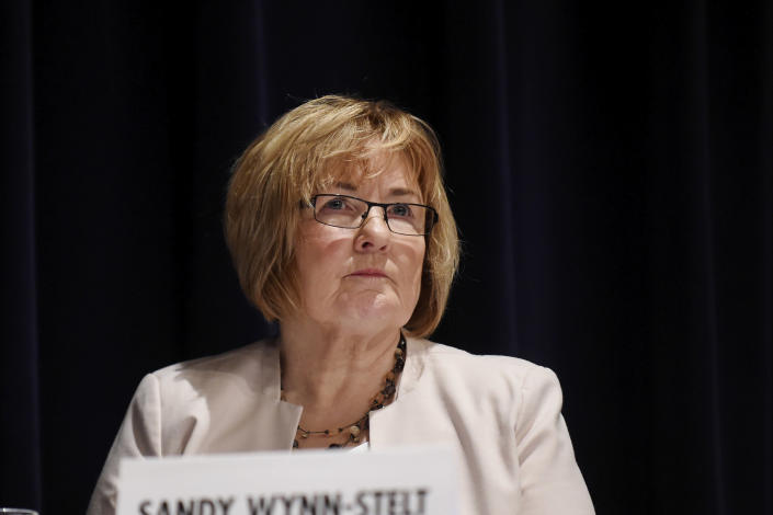 In this photo taken Nov. 13, 2018, Sandy Wynn-Stelt, of Belmont, Mich., testifies during a U.S. Senate subcommittee hearing at Grand Valley State University in Grand Rapids, Mich., about PFAS contamination of her well, believed to have come from a nearby industrial landfill. While estimates vary, studies say roughly 53 million U.S. residents rely on private wells. While many provide safe water, experts say some are vulnerable to contamination from bacteria or other impurities from floodwaters or from groundwater tainted with PFAS or other pollutants. (Neil Blake/The Grand Rapids Press via AP)