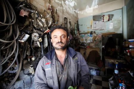 Ahmed Musaid al-Audi, 32, a car mechanic, poses for a photograph in Sanaa, Yemen, April 24, 2016. REUTERS/Mohamed al-Sayaghi