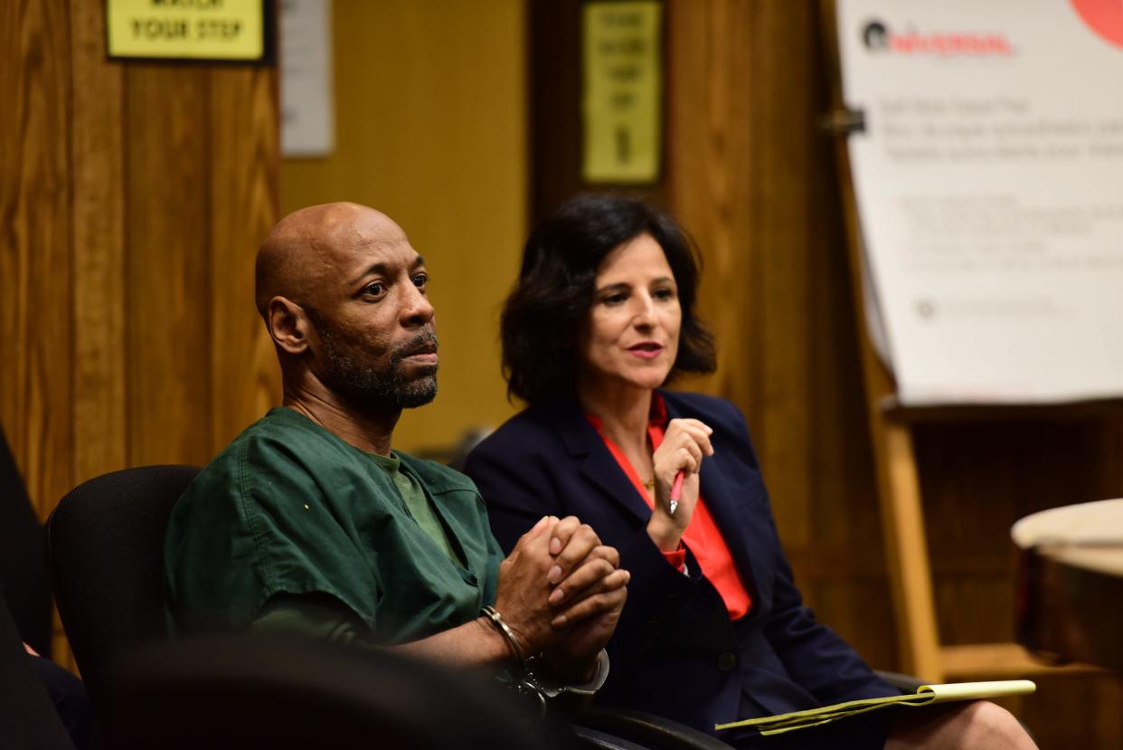 Eric Kelley, one of two men who have been behind bars for 24 years for the murder of Tito Merino, a Paterson video store clerk, with his attorney Vanessa Potkin, of the Innocence Project, for a bail reduction hearing.