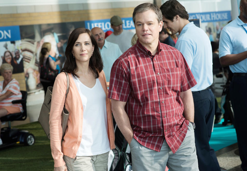 A woman and a man dressed casually and standing together