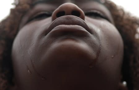 Camila vitoria, 15, cousin of Jenifer Gomes, 11, shot dead at the door of her house in Nova Jerusalem slum reacts during her funeral in Rio de Janeiro