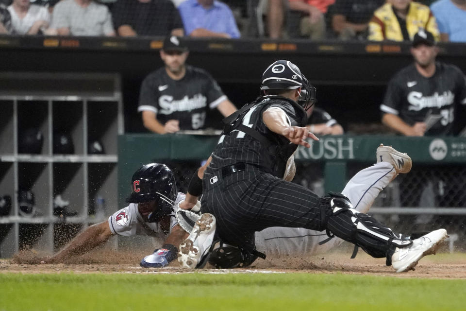 Chicago White Sox catcher Seby tags Cleveland Guardians' Amed Rosario at home during the seventh inning of a baseball game Tuesday, Sept. 20, 2022, in Chicago. Rosario was called out. (AP Photo/Charles Rex Arbogast)