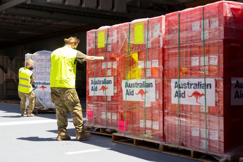 HMAS Adelaide carrying disaster relief sails into the port of Nuku'alofa