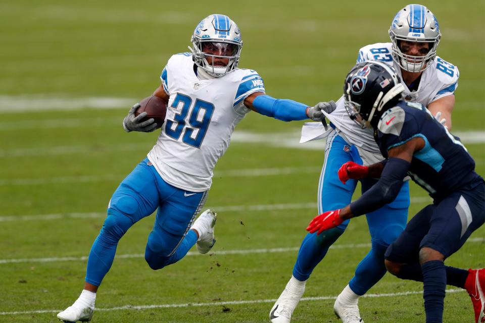 Wide receiver Jamal Agnew (39) of the Detroit Lions carries the football against the defense of the Tennessee Titans during the second quarter of the game Nissan Stadium on Dec. 20, 2020 in Nashville, Tennessee.