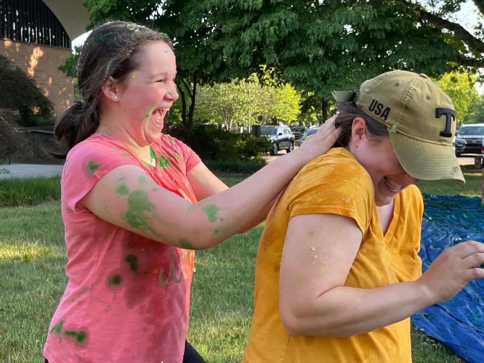 Sarah Doubleday, 13, slimes her mom, Faith, at a slime battle at Concord United Methodist Church Wednesday, June 23, 2022