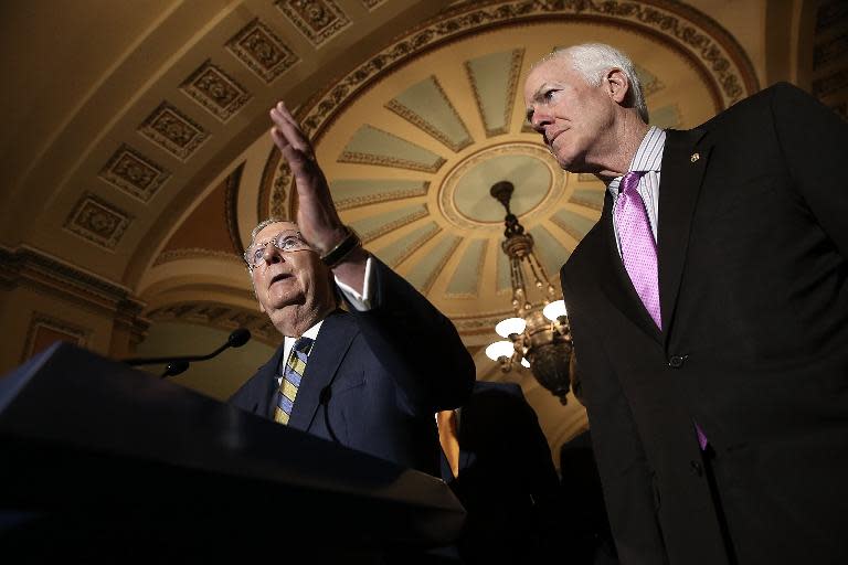 Senate Majority Leader Mitch McConnell (L) answers questions with Senator John Cornyn at the US Capitol on June 2, 2015 in Washington, DC