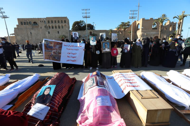 FILE PHOTO: Exhumed bodies from a mass grave are reburied in Tripoli