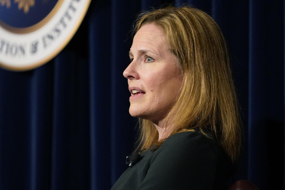 FILE - U.S. Supreme Court Associate Justice Amy Coney Barrett speaks at the Ronald Reagan Presidential Library Foundation in Simi Valley, Calif., Monday, April 4, 2022. On Friday, May 13, The Associated Press reported on stories circulating online incorrectly claiming Barrett cited a need for a “domestic supply of infants” in a leaked draft opinion for a decision that would overturn Roe v. Wade. (AP Photo/Damian Dovarganes, File)