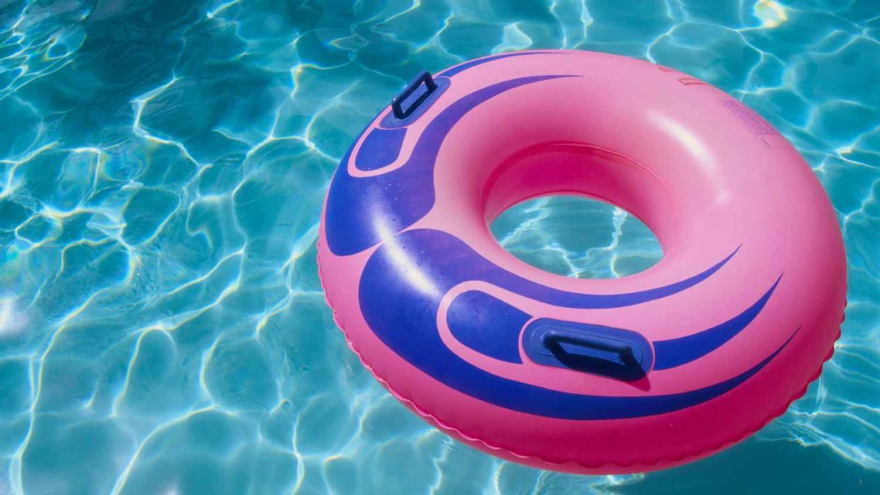 Pink inner tube in a swimming pool