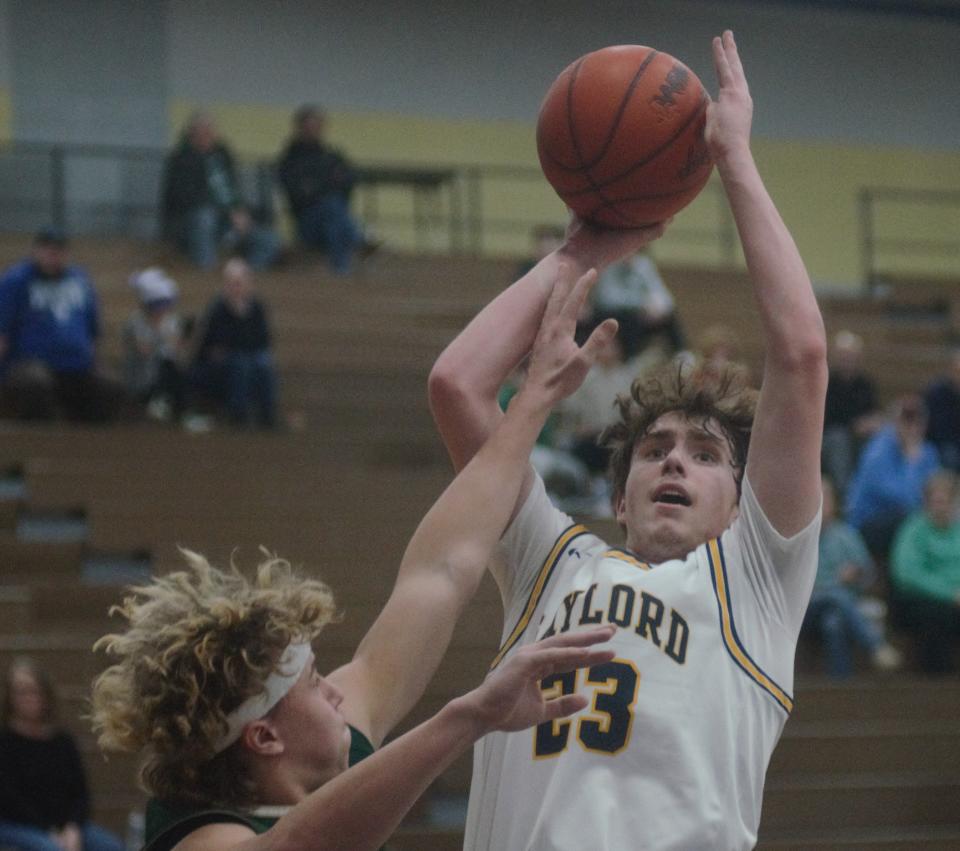 Luke Enders shoots from close during a basketball matchup between Gaylord and Traverse City West on Friday, February 10 in Gaylord, Mich.