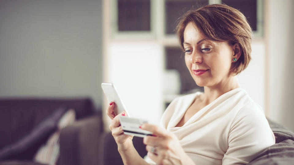 woman shopping on phone to avoid dynamic pricing