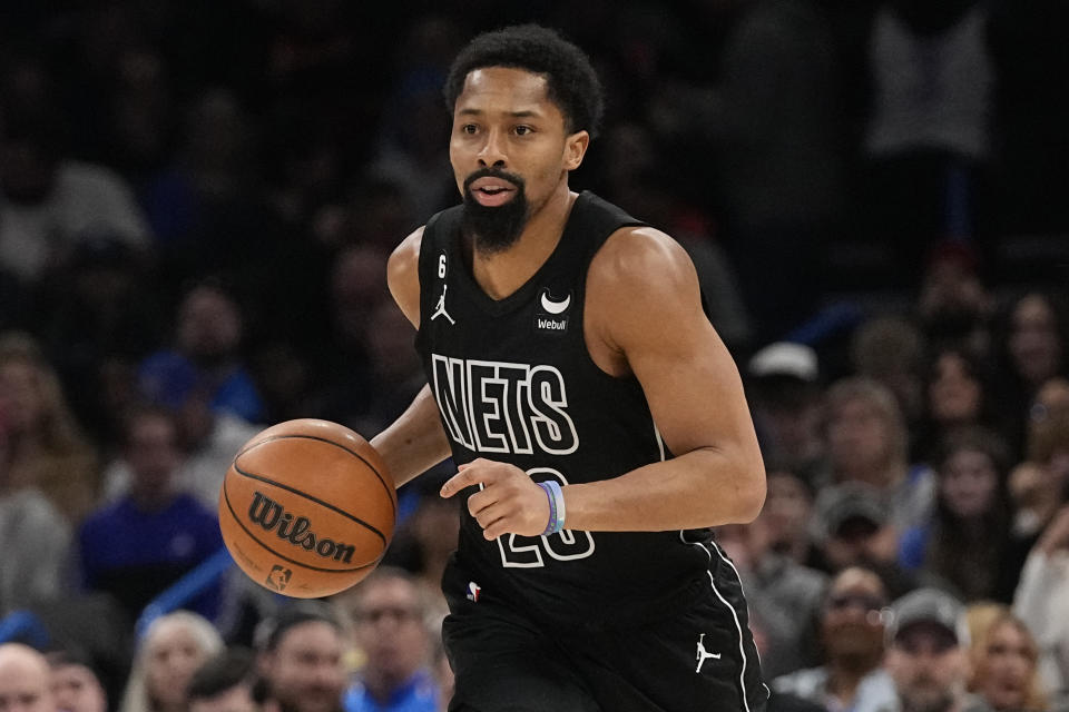 FILE - Brooklyn Nets guard Spencer Dinwiddie (26) plays during an NBA basketball game against the Oklahoma City Thunder, Tuesday, March 14, 2023, in Oklahoma City. With the Big Three-ring circus gone, Kevin Durant and Kyrie Irving weren't missed much in the regular season. Mikal Bridges and Cam Johnson, who came in the deal for Durant, and Spencer Dinwiddie and Dorian Finney-Smith, acquired from Dallas, stepped into the starting lineup and helped the Nets to 45 wins and the No. 6 seed. (AP Photo/Sue Ogrocki, File)