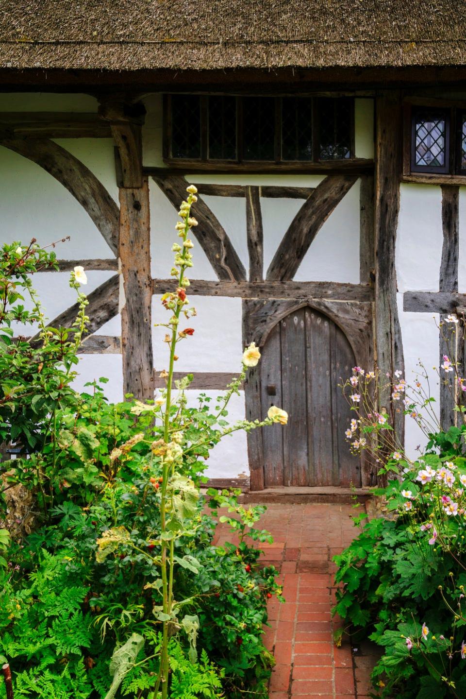 thatched cottage in an english village