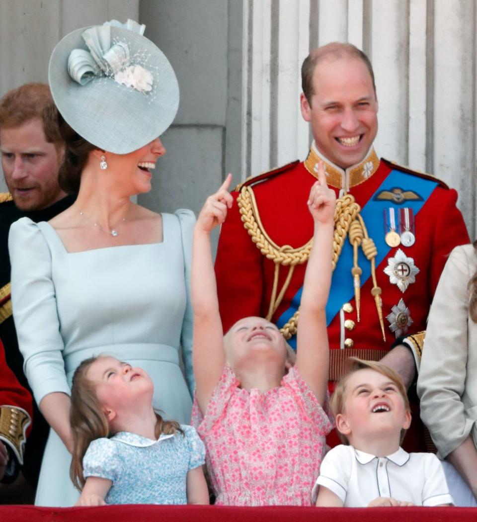 This time, Will and Kate are laughing with some youngsters.