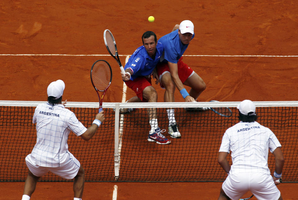 Stepanek of Czech Republic plays a shot next to Berdych during their Davis Cup World Group doubles match against Schwank and Berlocq in Buenos Aires
