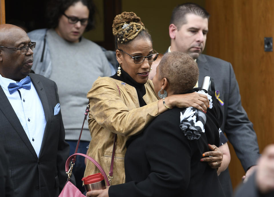 Friends and family attend a funeral mass for eight of the 20 people killed in last Saturday's fatal limousine crash in Schoharie, N.Y., during a memorial service at St. Stanislaus Roman Catholic Church in Amsterdam, N.Y., Saturday, Oct. 13, 2018. (AP Photo/Hans Pennink)