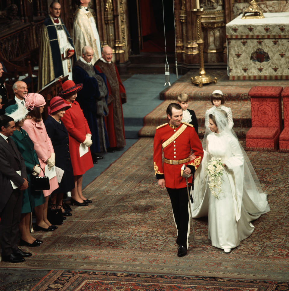 Princess Anne and Mark Phillips walk down the aisle together after being married at Westminster Cathedral. (Photo by © Hulton-Deutsch Collection/CORBIS/Corbis via Getty Images)