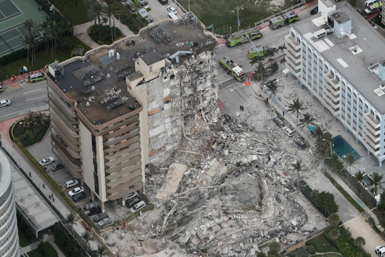 An aerial photo shows part of the 12-story oceanfront condo that collapsed in Surfside, Fla., early Thursday.  (Amy Beth Bennett/South Florida Sun-Sentinel via AP)