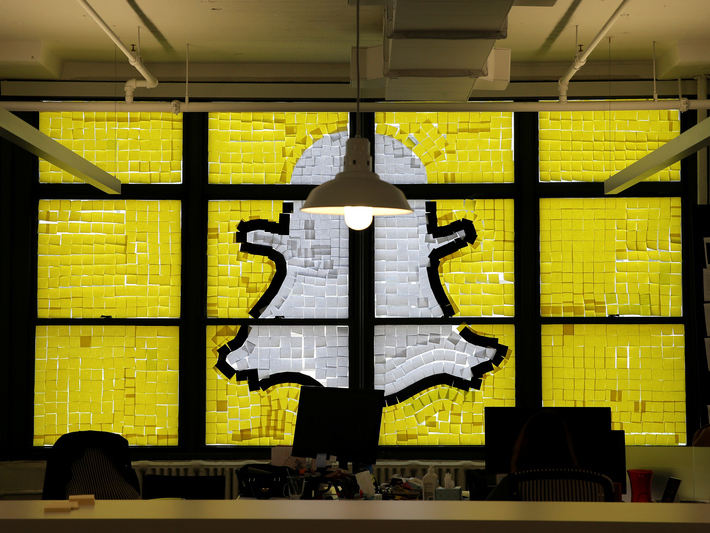 An image of the Snapchat logo created with Post-it notes is seen in the windows of Havas Worldwide at 200 Hudson Street in lower Manhattan, New York, U.S., May 18, 2016, where advertising agencies and other companies have started what is being called a 