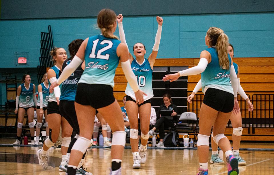 Members of the Gulf Coast High School volleyball team including, Kate Drasba, center, celebrate a point over Fort Myers during a game at Gulf Coast on Tuesday, Sept. 26, 2023. Gulf Coast won 3 sets to 1 set.