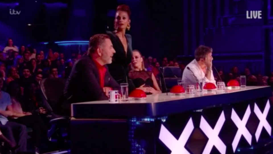 Judges Simon Cowell, Amanda Holden, Alesha Dixon and David Walliams were all left shocked as an intruder ran onto the stage pressing three of the four judges’ red buzzers. Source: ITV