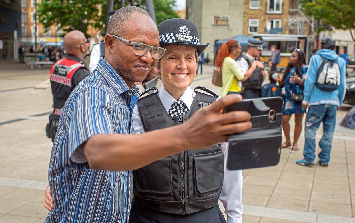 A man takes a selfie with Met Police Commissioner Cressida Dick: carl fox