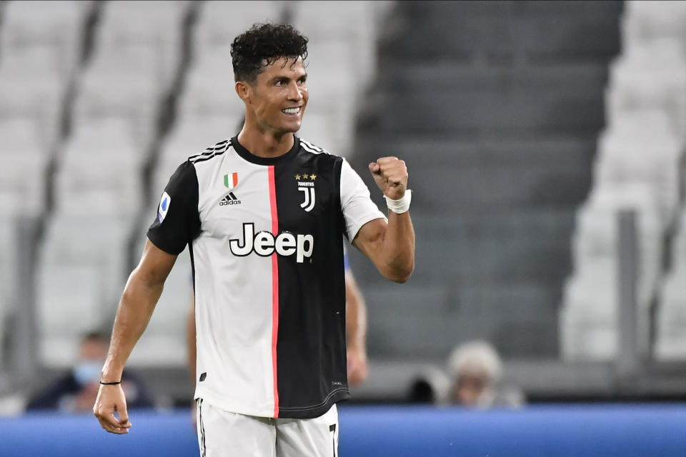 Cristiano Ronaldo celebrates a goal with a fist pump.