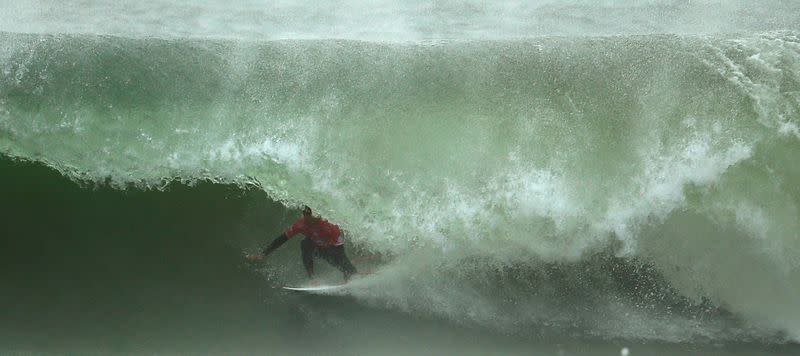 FILE PHOTO: Miguel Pupo of Brazil surfs during the World Surf League (WSL) championship at Supertubo beach in Peniche