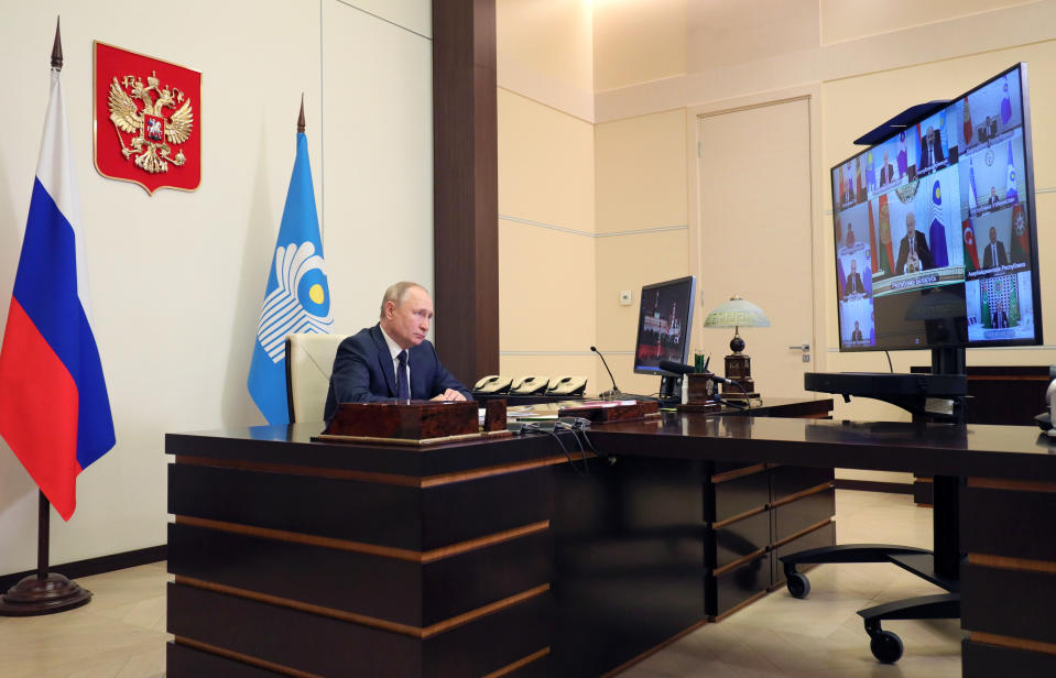 Russian President Vladimir Putin takes part in a virtual Summit of leaders from the Commonwealth of Independent States (CIS) at the Novo-Ogaryovo residence outside Moscow, Russia, Friday, Oct. 15, 2021. (Evgeniy Paulin, Sputnik, Kremlin Pool Photo via AP)