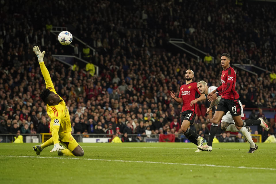 Galatasaray's Mauro Icardi, second from right, scores his side's third goal during the Champions League group A soccer match between Manchester United and Galatasaray at the Old Trafford stadium in Manchester, England, Tuesday, Oct. 3, 2023. (AP Photo/Dave Thompson)