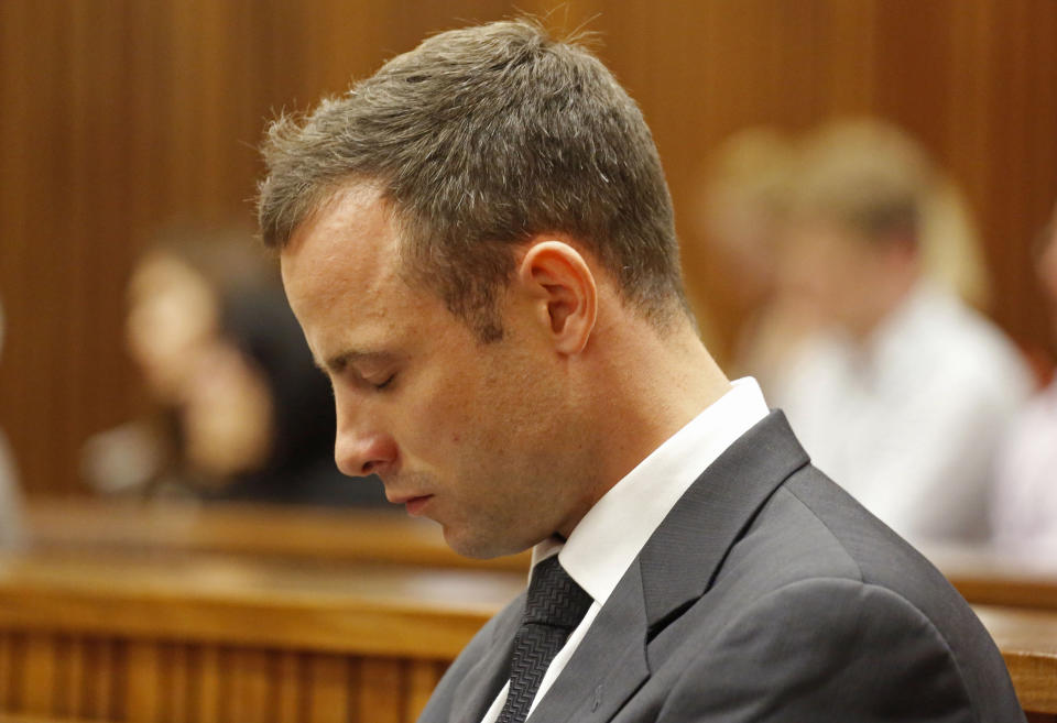 Oscar Pistorius, listens to cross questioning with shut eyes in court during his trial at the high court in Pretoria, South Africa, Friday, March 7, 2014. Pistorius is charged with murder for the shooting death of his girlfriend, Steenkamp, on Valentines Day in 2013. (AP Photo/Schalk van Zuydam, Pool)