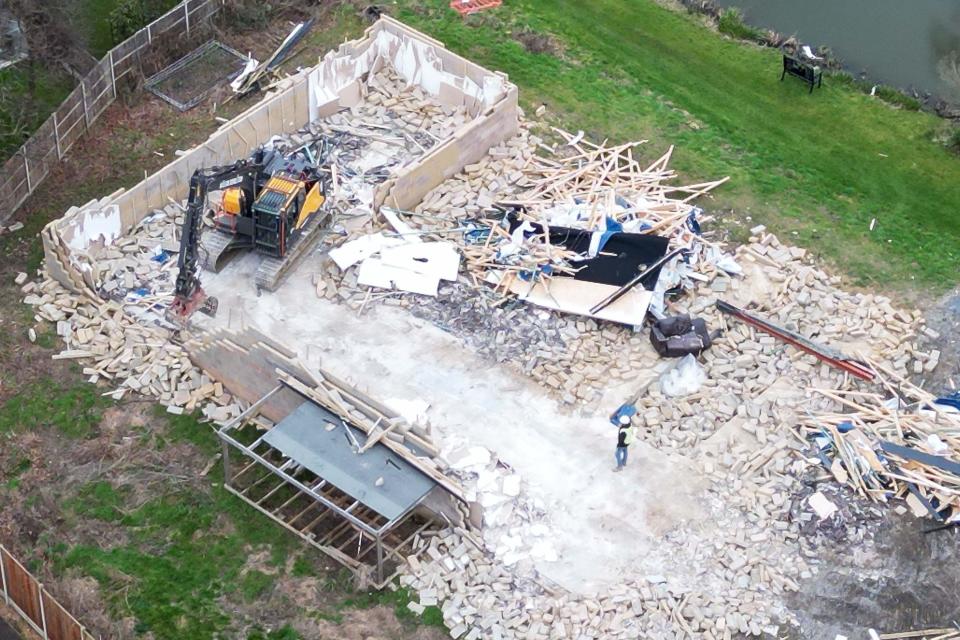 Work continues to demolish an unauthorised spa pool block at the home of Hannah Ingram-Moore, the daughter of the late Captain Sir Tom Moore, at Marston Moretaine, Bedfordshire. Picture date: Monday February 5, 2024.