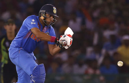 Cricket - India v Australia - World Twenty20 cricket tournament - Mohali, India - 27/03/2016. India's Yuvraj Singh plays a shot. REUTERS/Adnan Abidi